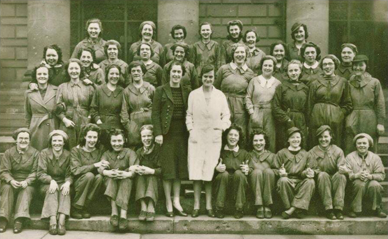 Group of women outside English Steel Corporation during WW2