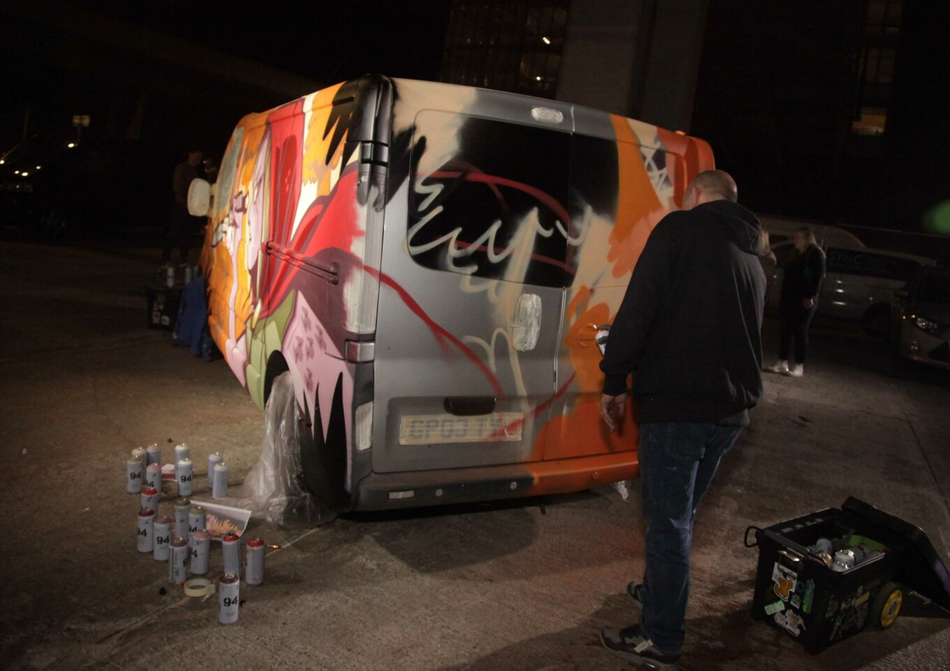 Jay and Hammo painting a van at Art Battle XX in Stockport