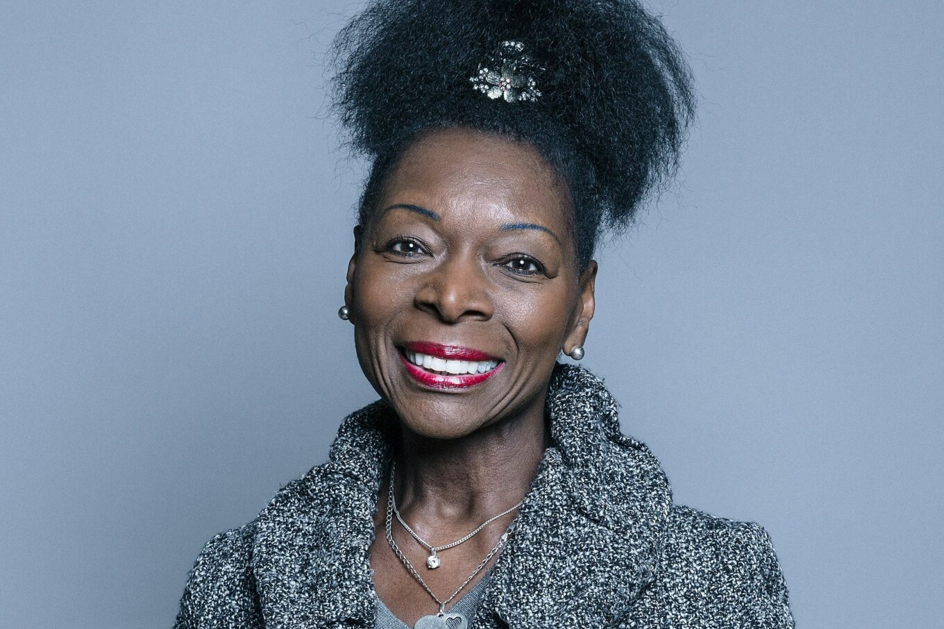 A photo of a smiling Black woman