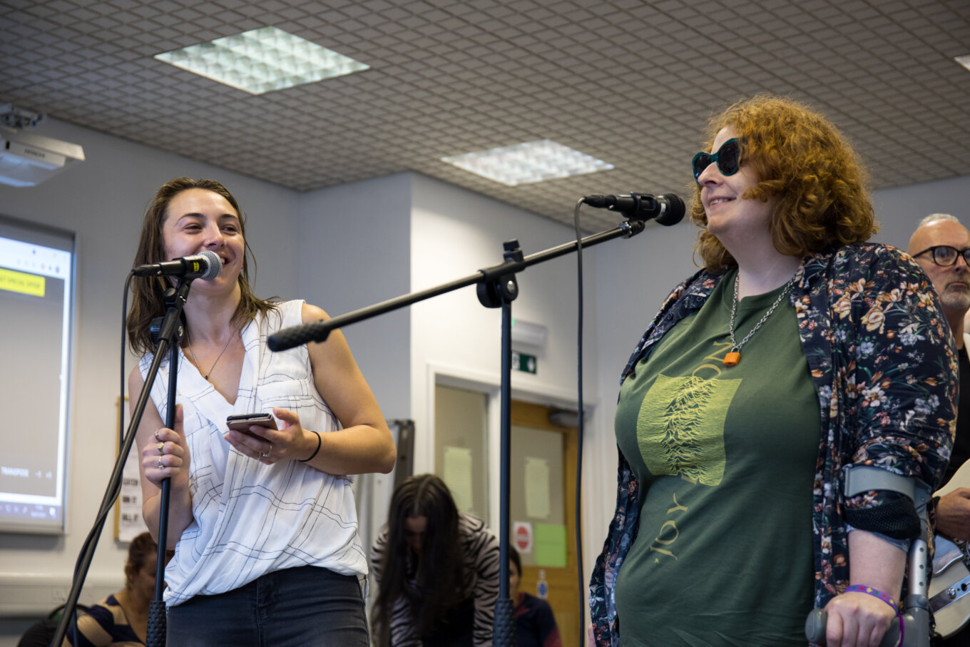 Two women with microphones