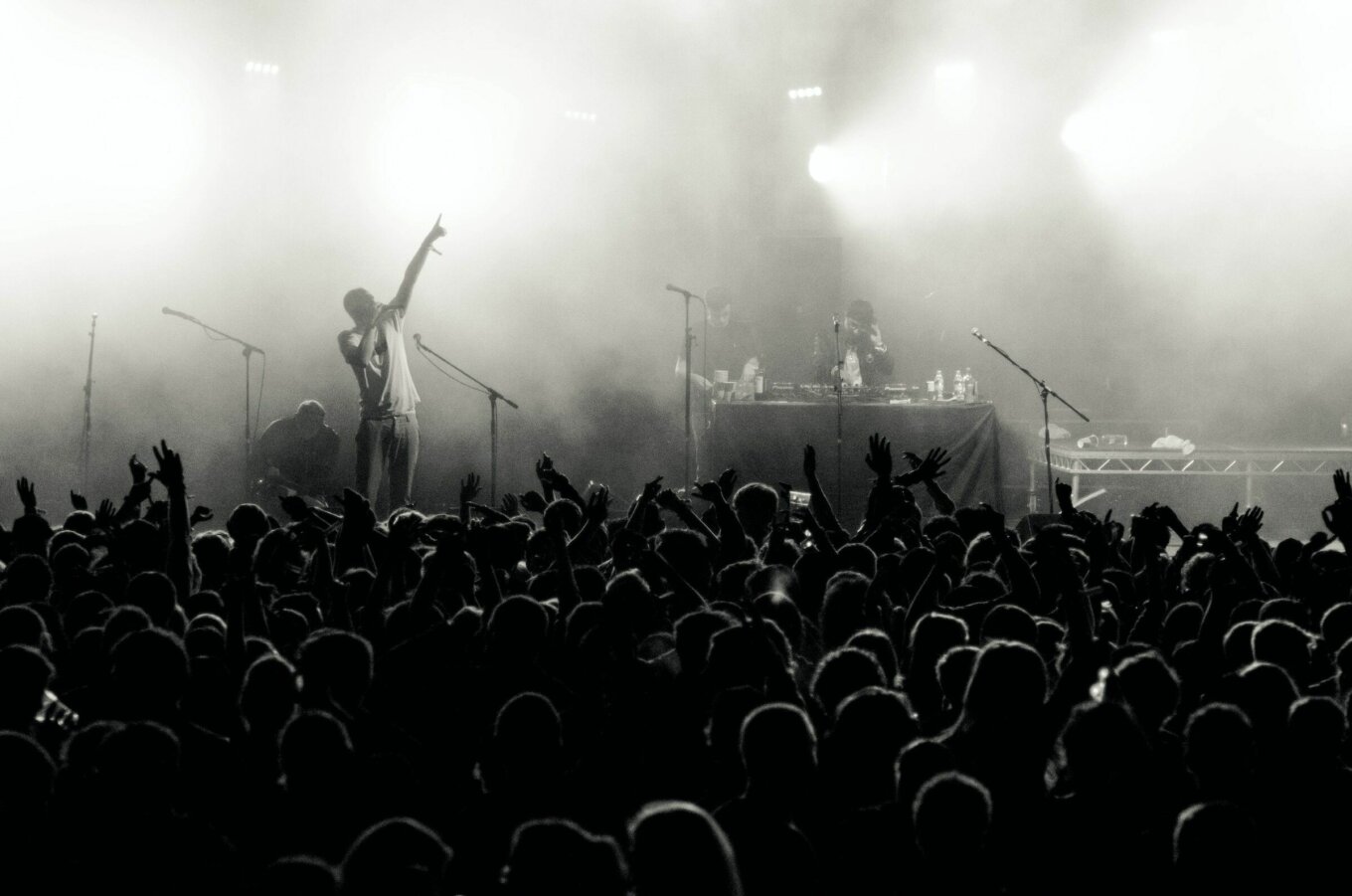Grayscale photo of people in concert.