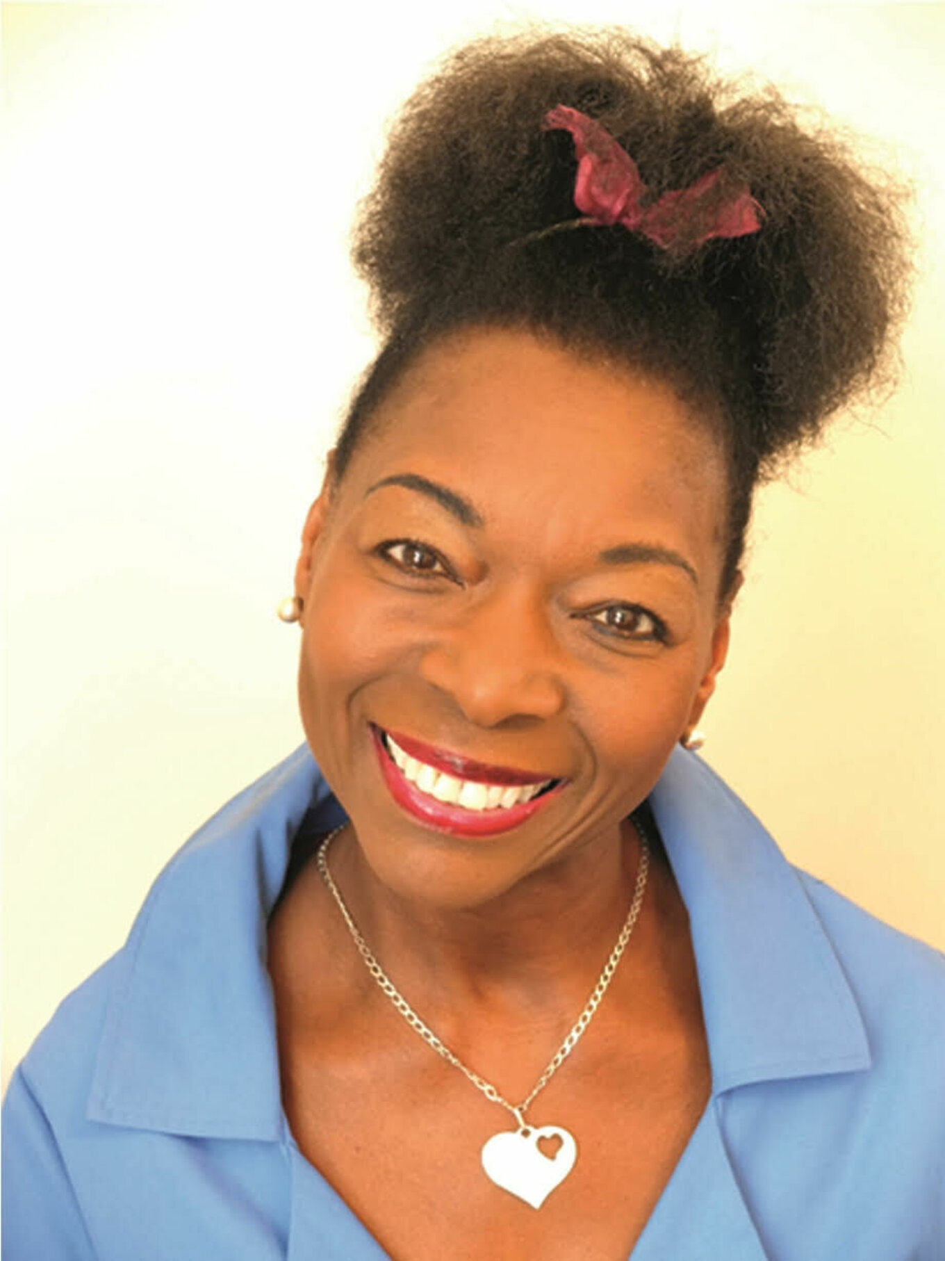 A photograph of a smiling Black woman