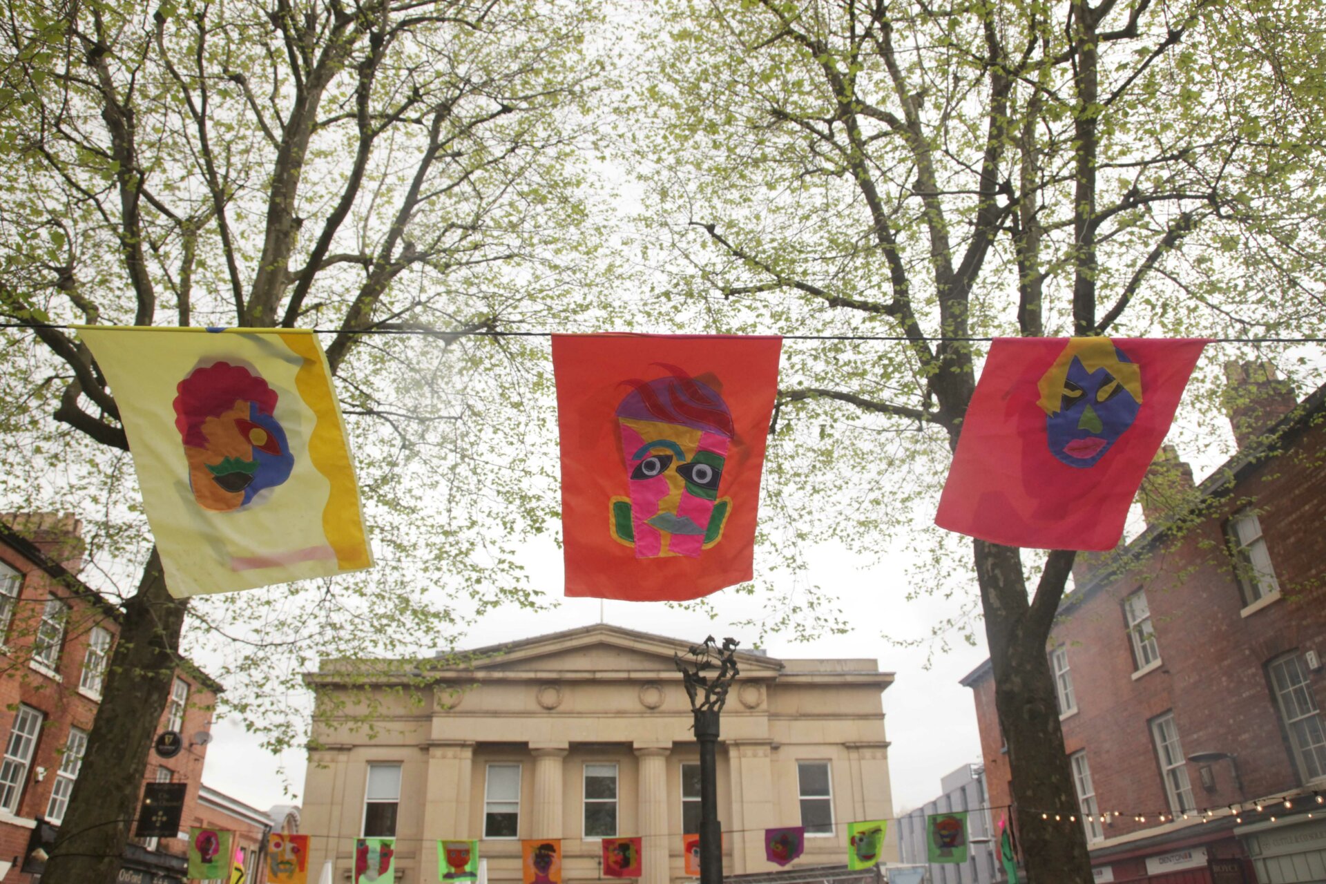 Arty flags flying at Bexley Square during Sounds from the Other City Festival