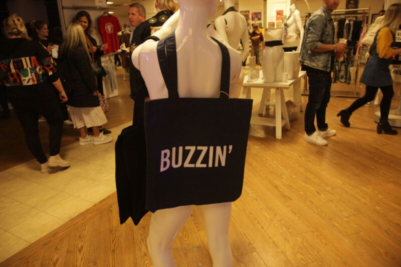 Buzzin tote bag on a mannequin at the art market at Art Battle XX in Stockport