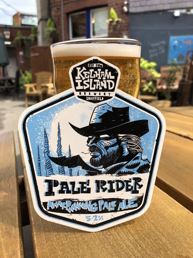A pint of beer with a Pale Rider logo.