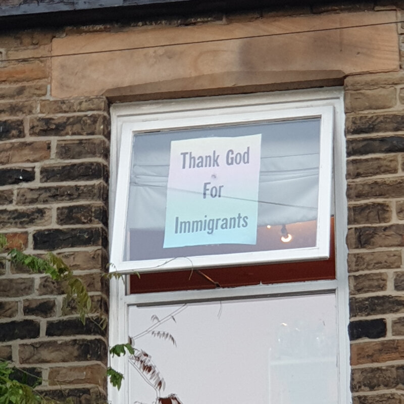 'Thank God For Immigrants' window sign